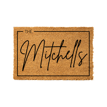 Doormat with 'The Mitchells' text on a white background